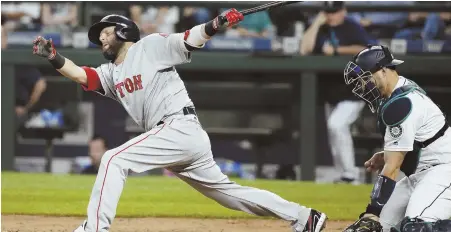  ?? AP PHOTO ?? SOMETHING’S MISSING: Dustin Pedroia strikes out swinging during the Red Sox’ 4-0 loss Monday in Seattle. The Sox entered last night losers of three straight and averaging just 3.25 runs in their last 12 games.