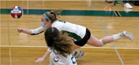  ?? STUART CAHILL PHOTOS / HERALD STAFF ?? GOING ALL OUT: Canton’s Stephanie Trendell digs the ball out against Oliver Ames on Wednesday in Canton. Below, Canton’s Elizabeth Bickett stuffs OA’s Tori Harney at the net.