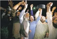  ?? ANJUM NAVEED AP ?? Opposition party supporters celebrate the success of a noconfiden­ce vote against Prime Minister Imran Khan today.