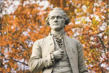  ?? Frank Franklin II / Associated Press ?? A statue of Alexander Hamilton stands in New York’s Central Park. A new research paper takes a swipe at his image as the abolitioni­st founding father, citing evidence that he was a slave trader and owner himself.