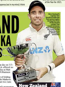  ?? ?? New Zealand’s captain Tim Southee holds the Test series trophy during day four of the second cricket Test match between New Zealand and Sri Lanka at the Basin Reserve in Wellington yesterday