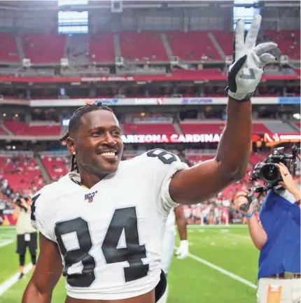  ?? MARK J. REBILAS/USA TODAY SPORTS ?? Raiders wide receiver Antonio Brown waves to the crowd against the Cardinals during a preseason game Thursday at State Farm Stadium in Glendale, Arizona.