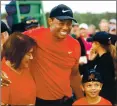  ?? ANDREW REDINGTON — GETTY IMAGES ?? Tiger Woods shares his 2019 triumph at the Masters with his son. Tiger and Charlie will form a team at the upcoming PNC Championsh­ip.