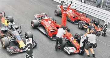  ??  ?? Ferrari’s German driver Sebastian Vettel celebrates on his car after winning the Monaco Formula 1 Grand Prix at the Monaco street circuit in Monaco. — AFP photo