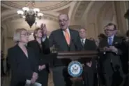  ?? THE ASSOCIATED PRESS ?? Senate Minority Leader Chuck Schumer, D-N.Y., Sen. Patty Murray, D-Wash., Sen. Debbie Stabenow, D-Mich., and Sen. Dick Durbin, D-Ill., the assistant Democratic leader, talks to reporters.