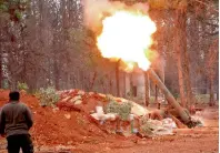  ?? AFP ?? Rebel fighters from the Jaish Al Fatah brigades fire a home-made mortar launcher during a major assault on Syrian government forces west of Aleppo city. —