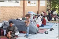  ?? Wakil Kohsar/AFP / TNS ?? Internally displaced Afghan families, who fled from the northern province due to battle between Taliban and Afghan security forces, sit in the courtyard of the Wazir Akbar Khan mosque in Kabul on Friday.