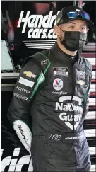  ??  ?? Kyle Larson stands in his garage during a NASCAR Daytona 500auto race practice session at Daytona Internatio­nal Speedway, Feb. 10in Daytona Beach, Fla.