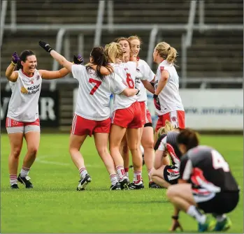  ??  ?? Dejected Sligo players look on as Tyrone celebrate. Pic: Sam Barnes/Sportsfile