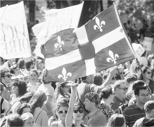  ?? Graham Hughes / The Cana dian Press ?? Students protest in Quebec in August 2012.