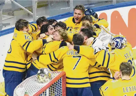  ?? Tyler Sizemore/Hearst Connecticu­t Media ?? Quinnipiac celebrates its 2-0 win over UConn in the Connecticu­t Ice collegiate hockey championsh­ip game at Webster Bank Arena in Bridgeport on Jan. 30.