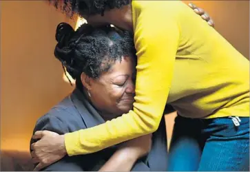  ?? Photograph­s by Christina House For The Times ?? TONNIETTA Mauricico, left, is comforted at a volunteer-run women’s shelter in L.A. Mauricico, 40, is back in school and trying to get a room to share near the Glendale campus. “I’m getting normal again,” she said.