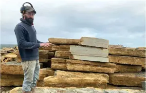  ??  ?? Mark Haysom with beds of freshly quarried Purbeck Marble. Right: his father, Treleven Haysom, with a dinosaur footprint found on the Isle of Purbeck. The wall of his museum is lined with dinosaur footprints