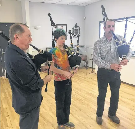  ??  ?? Pipers gather at least once a week at the College of Piping in Summerside, P.E.I., to practise together. Dr. Robert McKay, left, describes it as similar to a family atmosphere.