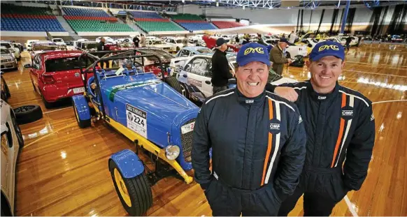  ?? Photo: Chris Kidd ?? DYNAMIC DUO: Toowoomba rally team driver Graham Copeland (left) and navigator Josh Herbert with their 1941 GMC at the Silverdome, Launceston, prior to competing in Targa Tasmania 2018.