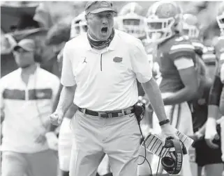  ??  ?? Florida coach Dan Mullen yells to a referee about a call during a game against South Carolina. Mullen is winless as a head coach against Alabama’s Nick Saban. The Florida coach is hardly alone.