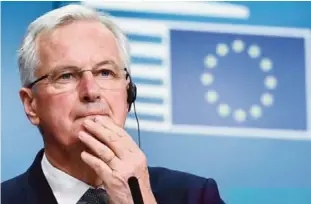  ??  ?? BRUSSELS: European Commission member in charge of Brexit negotiatio­ns with Britain, Michel Barnier, reacts during a press conference at the end of a general affairs council at the European Council in Brussels. —AFP