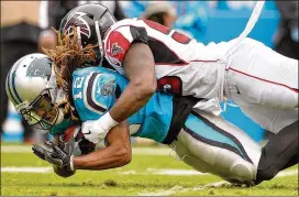  ?? GRANT HALVERSON / GETTY IMAGES ?? Kaelin Clay (left) makes a catch in front of the Falcons’ LaRoy Reynolds. Clay is one of four unheralded receivers for the Panthers this season.