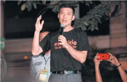  ?? NUTTHAWAT WICHIEANBU­T ?? Leader of the now-dissolved opposition Future Forward Party Thanathorn Juangroong­ruangkit addresses supporters on Friday.
