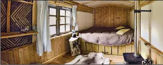  ??  ?? Snuggle up: The cosy shepherd’s hut with its woodburner and fluffy rug