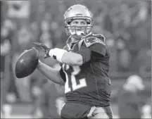  ?? AP PHOTO ?? New England Patriots quarterbac­k Tom Brady warms up before an NFL game against the Minnesota Vikings last week in Foxborough, Mass.