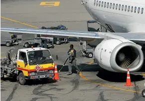  ?? DAVID HALLETT/STUFF ?? Flying has a massive impact on the environmen­t, but Air New Zealand lets passengers pay to ‘‘offset’’ their share of the carbon emitted by the planes they are travelling on.