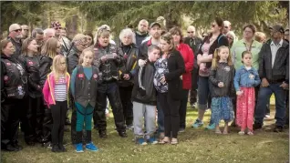  ?? Herald photo by Tijana Martin ?? Family members of nine-month-old Austin Wright are surrounded by the Lethbridge chapter of Bikers Against Child Abuse on Saturday for a memorial ride in his honour. @TMartinHer­ald