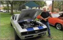  ?? TAWANA ROBERTS – THE NEWS-HERALD ?? Bernie Herman presents a 1968 Camaro at the Painesvill­e Car Cruise on Aug. 10.