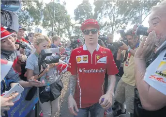  ??  ?? Ferrari driver Kimi Raikkonen arrives at the Melbourne Grand Prix Circuit.