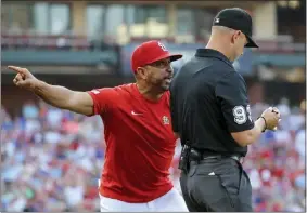  ?? SCOTT KANEL — THE ASSOCIATED PRESS ?? St. Louis Cardinals manager Oliver Marmol argues with umpire Will Little during the first inning Thursday in a loss to the Chicago Cubs. Marmol and pitcher Miles Mikolas were ejected.