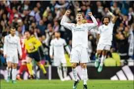  ?? PHOTOS BY DAVID RAMOS / GETTY IMAGES ?? Cristiano Ronaldo of Real Madrid celebrates victory in the UEFA Champions League semifinal second-leg match against Bayern Munich on May 1 in Madrid.