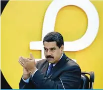  ?? — AFP ?? CARACAS: Venezuela’s President Nicolas Maduro applauds during a press conference to launch a new oil-backed cryptocurr­ency called “Petro” at the Miraflores Presidenti­al Palace on Feb 20, 2018.