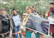  ?? HT FILE ?? A woman protests the mandatory linking of the Aadhaar number to the ration card for getting govt benefits in New Delhi in 2017.