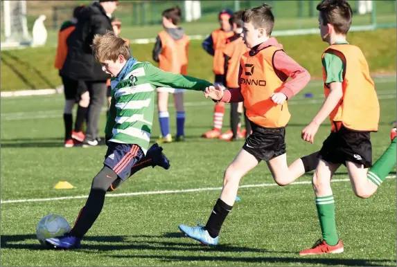  ?? Photo by Michelle Cooper Galvin ?? Josh Bowler, Killarney Celtic puts the ball across goal against Camp in the Kerry Schoolboys Under 11 at Celtic Park, Killarney on Saturday.