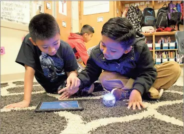  ?? Spencer Lahr / RN-T ?? East Central third-graders Vladimyi Jeronomo (right) and Sergio Hernandez set the commands for their Sphero during class.