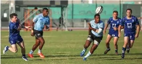  ?? Victor Besa for The National ?? Jebel Ali Dragons, in dark blue, played Olympic champions Fiji in a friendly on Saturday