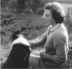  ??  ?? Idyllic: Janet White on Aroa with a sheepdog in 1954