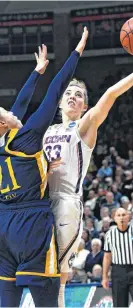  ??  ?? Connecticu­t’s Katie Lou Samuelson (33) shoots over Quinnipiac’s Jen Fay (21) during Monday’s second-round game in the NCAA women’s college basketball tournament in Storrs, Conn. UConn won, 71-46.