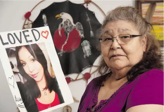  ?? BRUCE EDWARDS/EDMONTON JOURNAL ?? Katie Dene holds a photo of her granddaugh­ter, Shelly Dene, who went missing in August 2013. Her family hasn’t heard from her since. According to an RCMP report released in May 2014, there are 225 unsolved cases of missing and murdered aboriginal women in Canada.