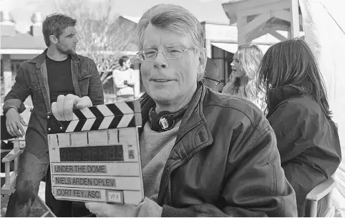  ?? THE CANADIAN PRESS ?? Stephen King is pictured on the set of Under The Dome, a summer series that provides an alternativ­e to the usual reality fare.