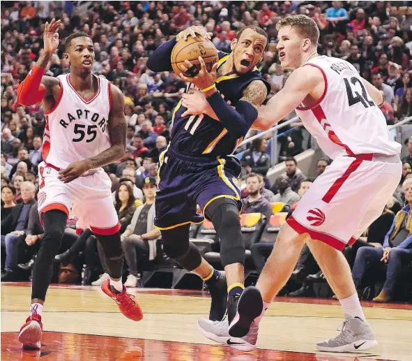  ?? — THE CANADIAN PRESS FILES ?? Toronto Raptors centre Jakob Poeltl, right, is still called for too many fouls adjusting to playing the likes of Indiana Pacers guard Monta Ellis, middle, but the rookie is showing steady improvemen­t and seeing more playing time as the season progresses.