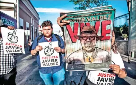  ?? RASHIDE FRIAS/AFP ?? Journalist­s, friends and relatives demand justice on the first anniversar­y of Mexican journalist Javier Valdez’s murder, in Culiacan, Sinaloa, Mexico, on Tuesday.