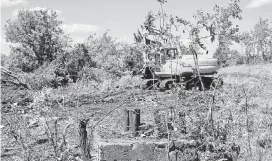  ?? [PHOTO PROVIDED] ?? A trackhoe led efforts by the Oklahoma Energy Resources Board in 2017 to begin restoring its 1,000th abandoned well site in Osage County. The site was restored to grassland by the time the project was completed.