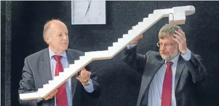  ?? Photo: JOHN KIRK-ANDERSON/FAIRFAX NZ ?? Like dominoes: Structural engineers Dr Richard Sharpe, left, and Rob Jury explain at the Canterbury earthquake­s royal commission hearing yesterday howthe stairs in the Forsyth Barr Building in Christchur­ch failed during the February 22 earthquake last...