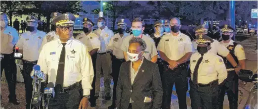  ?? KATHY CHANEY/SUN-TIMES ?? Chicago Police Supt. David Brown and Mayor Lori Lightfoot speak outside Stroger Hospital early Sunday after two Chicago police officers and a suspect were wounded in a shooting incident in the 3300 block of West Polk Street.