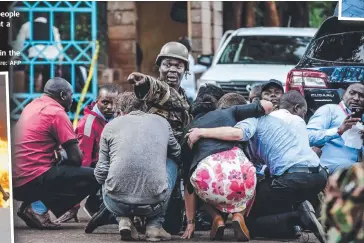  ?? Picture: AFP ?? FEAR: Special forces protect people at the scene of an explosion at a hotel complex in Nairobi and, above right, security camera footage of an armed attacker in the hotel compound,