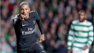  ?? AP ?? pSG’s Kylian Mbappe (left) celebrates after scoring a goal against Celtic. —