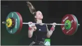  ?? The Associated Press ?? Canada’s Rachel Leblanc-Bazinet competes in the women’s 53-kilogram weightlift­ing final during the Commonweal­th Games, in Gold Coast, Australia, on Friday. Leblanc-Bazinet won bronze.