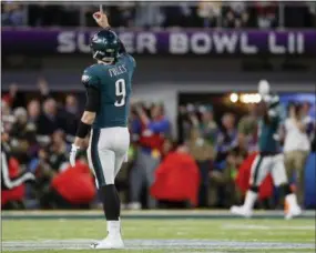  ?? JEFF ROBERSON - AP ?? Philadelph­ia Eagles quarterbac­k Nick Foles celebrates a touchdown pass to Zach Ertz during the second half of Super Bowl 52 against the New England Patriots Sunday.