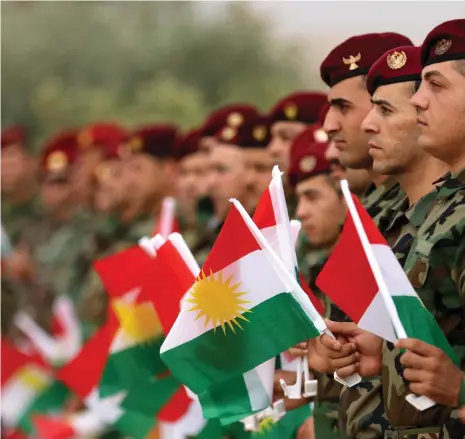  ?? Reuters; AFP ?? Iraqi Kurdish president Masoud Barzani at a rally, top. Kurdish peshmerga show their support for Monday’s referendum